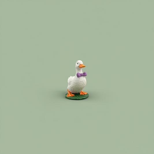 Duck with Purple Bow on Lily Pad