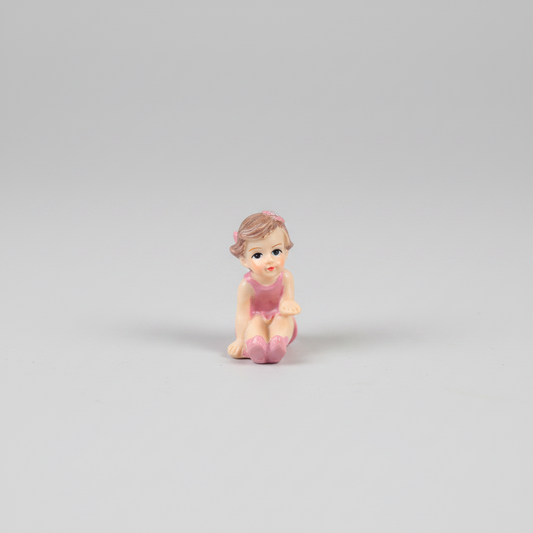 Girl Sitting in Pink Dress