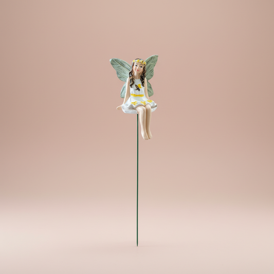 Bee & Blossom fairy garden stake figurine photographed on a solid blush pink studio background with soft, even lighting