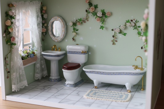 Miniature porcelain bathroom set with blue Art Deco border styled in a whimsical dollhouse setting