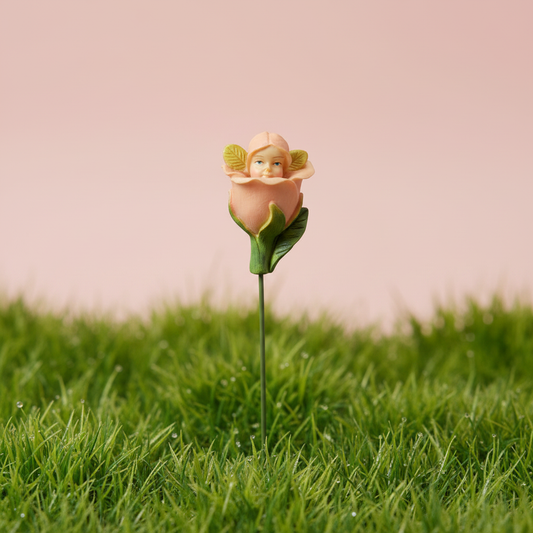 Flower Fairy Peach garden stake figurine planted in grass