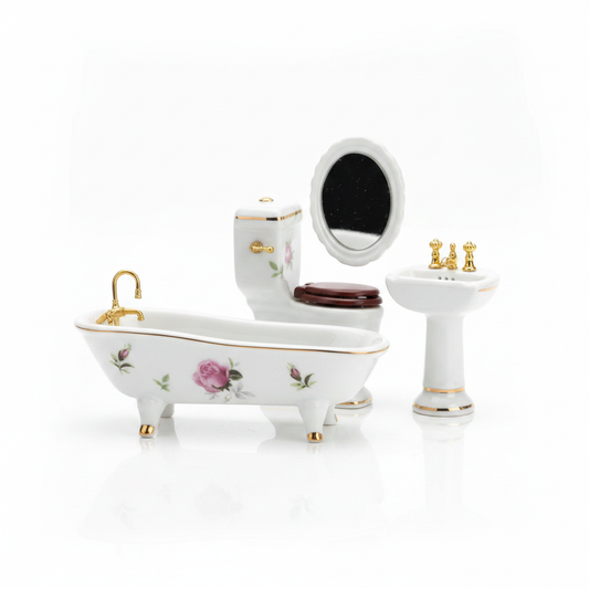 Miniature porcelain bathroom set with gold trim and rose florals on white background
