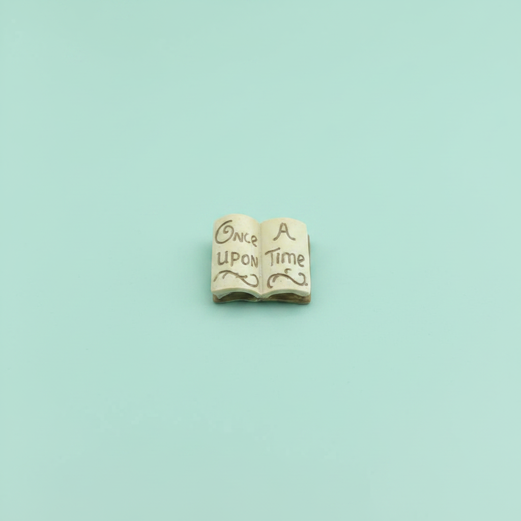 Once Upon A Time miniature resin open book on mint green background