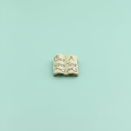 Once Upon A Time miniature resin open book on mint green background
